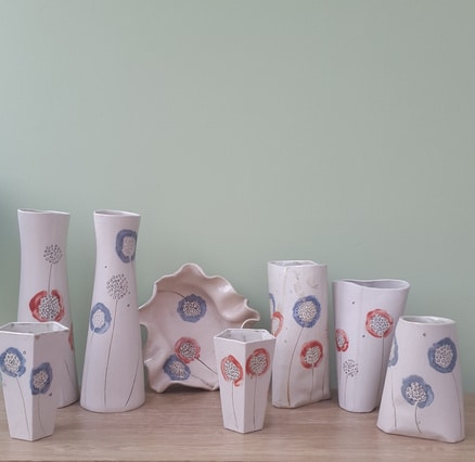 ceramic vases with red and blue dandelion design