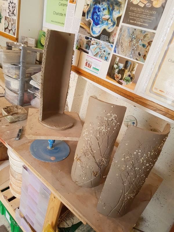 hand building a vase