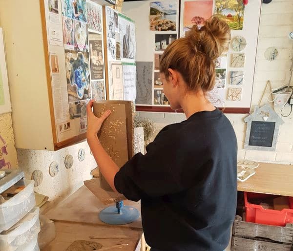 hand building a vase