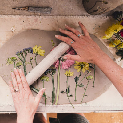 Charlotte Hupfield Ceramics rolling flowers into clay