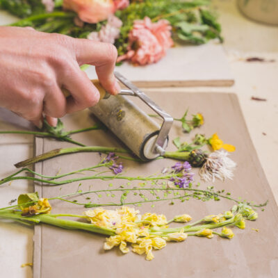 pressing flowers into clay pressing flowers into clay