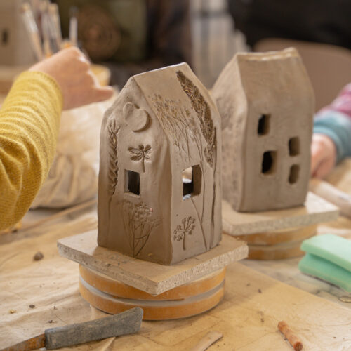 cut out windows ceramic tea light house